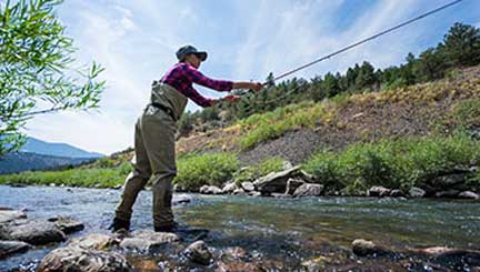 Colorado River – Female casting fly rod on Colorado River.