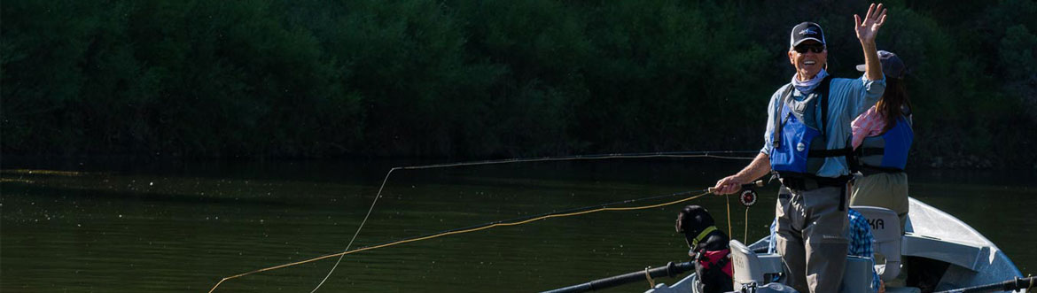 Waving fisherman in a boat